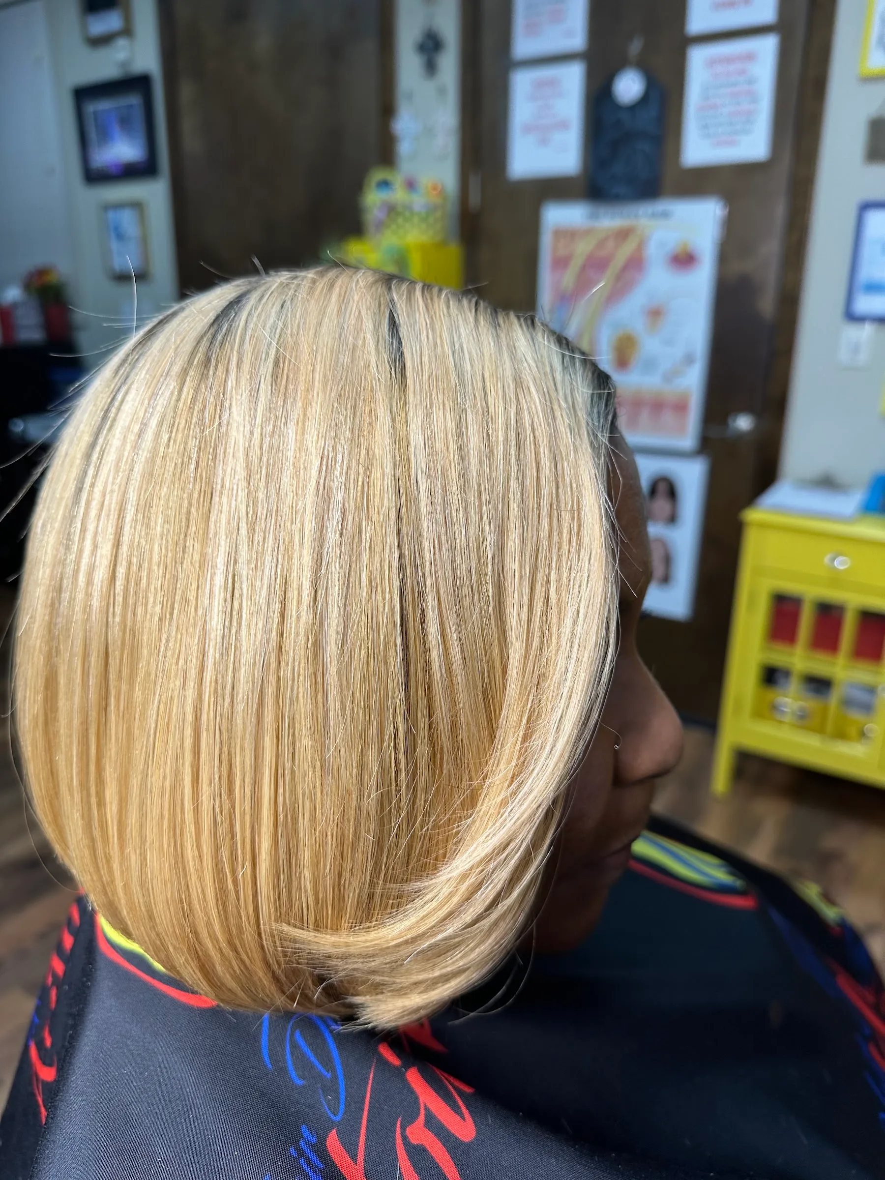Blonde bob with dark roots, viewed from the side